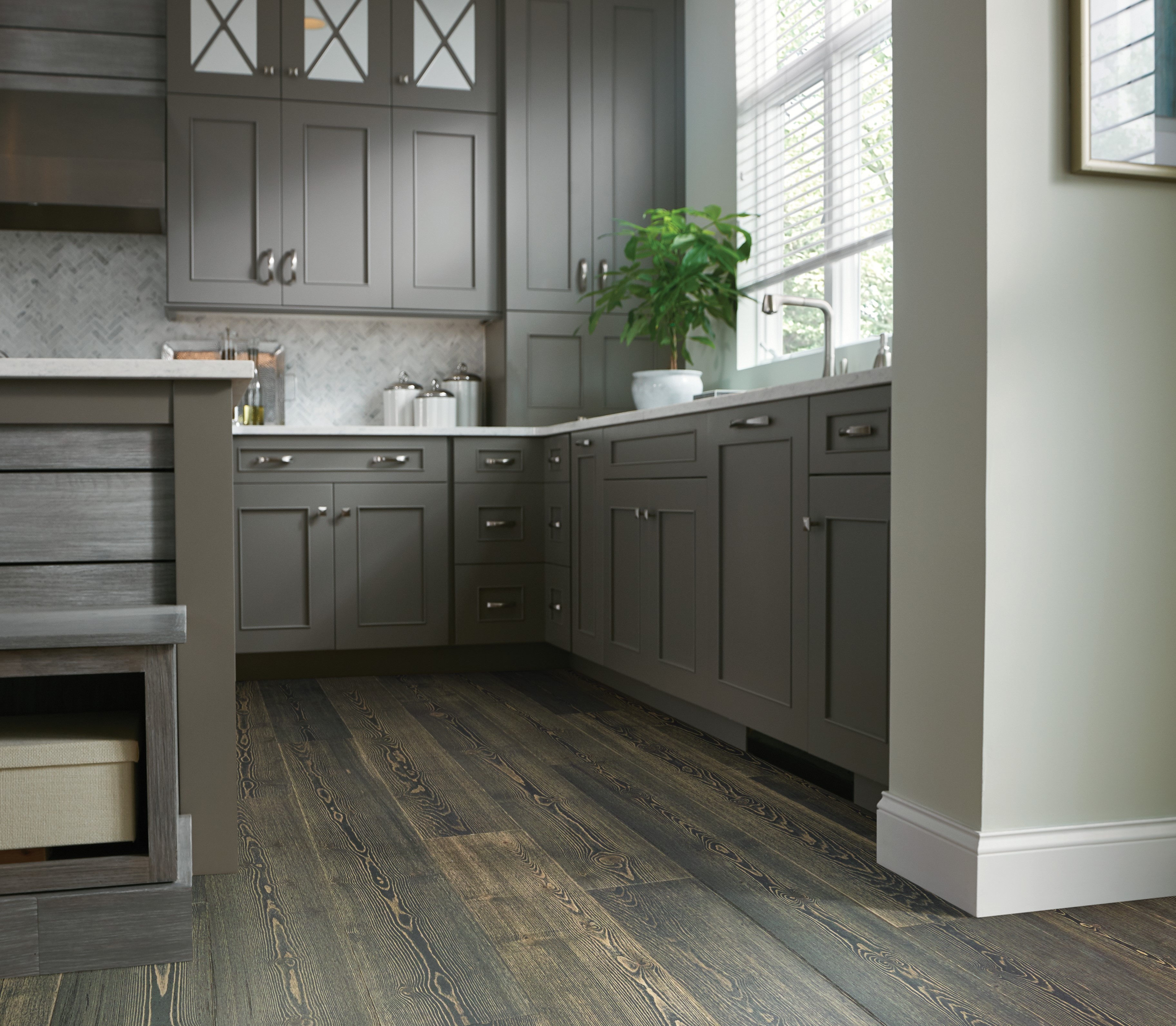 Exquisite-Midnight Pine hardwood in a kitchen featuring brown, contemporary cabinetry and island